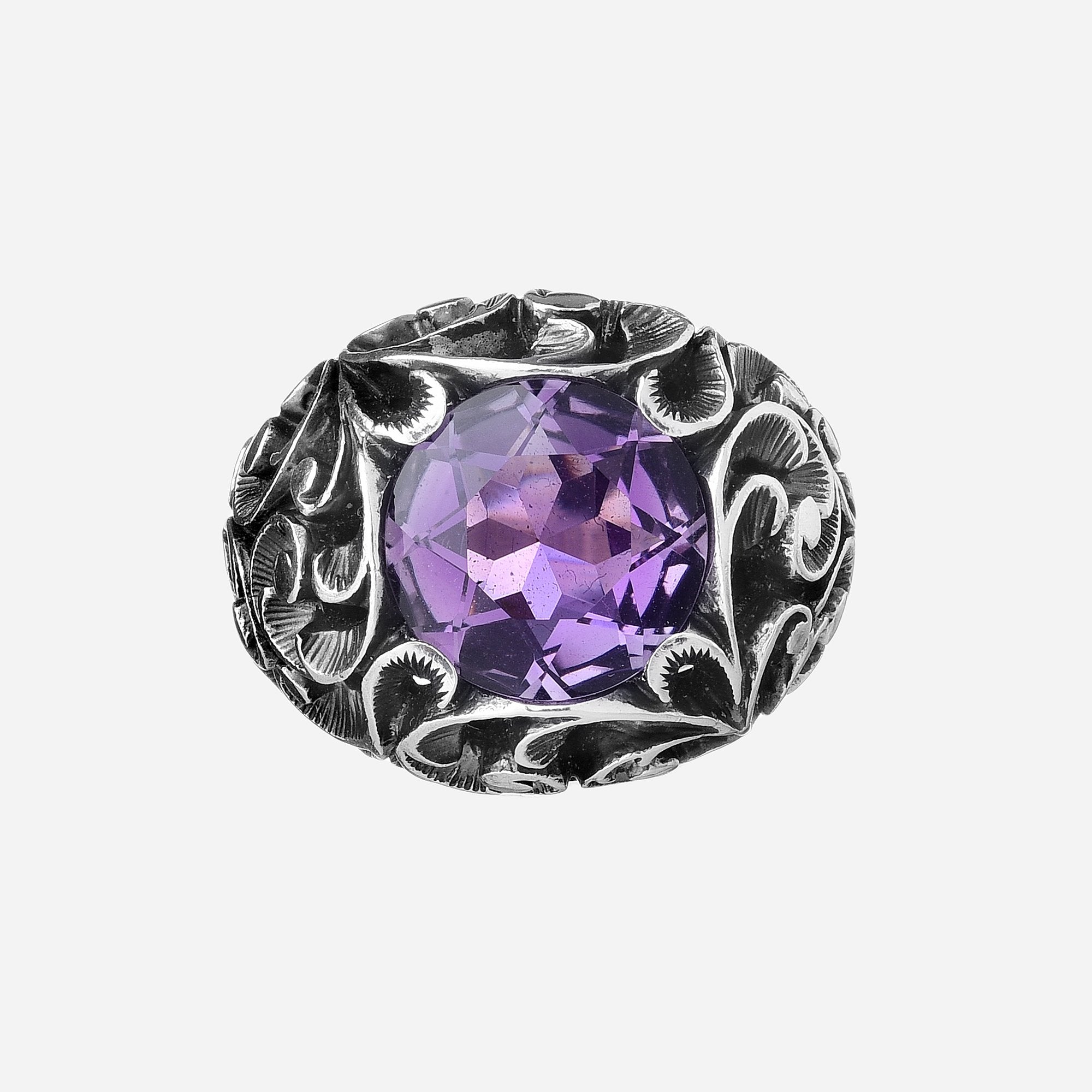 Ring with faceted round cut stone