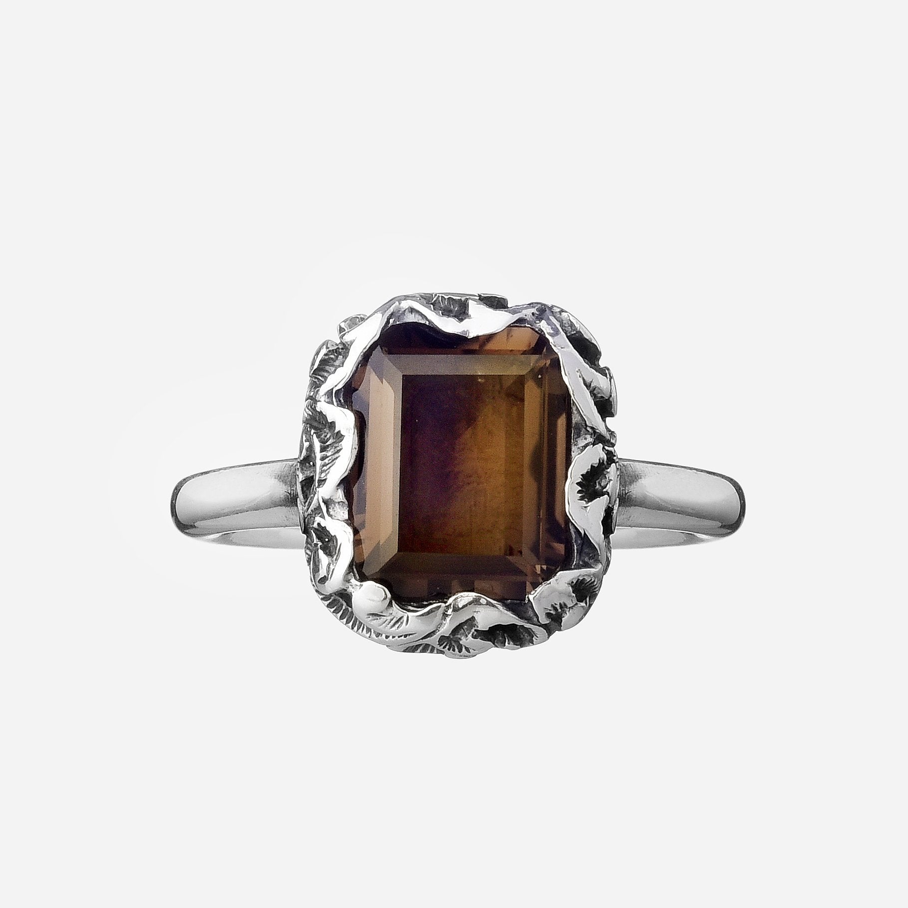Ring with emerald cut stone