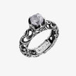Anello solitario in argento brunito, gambo inciso, pietra taglio tondo sfaccettato 6 mm.