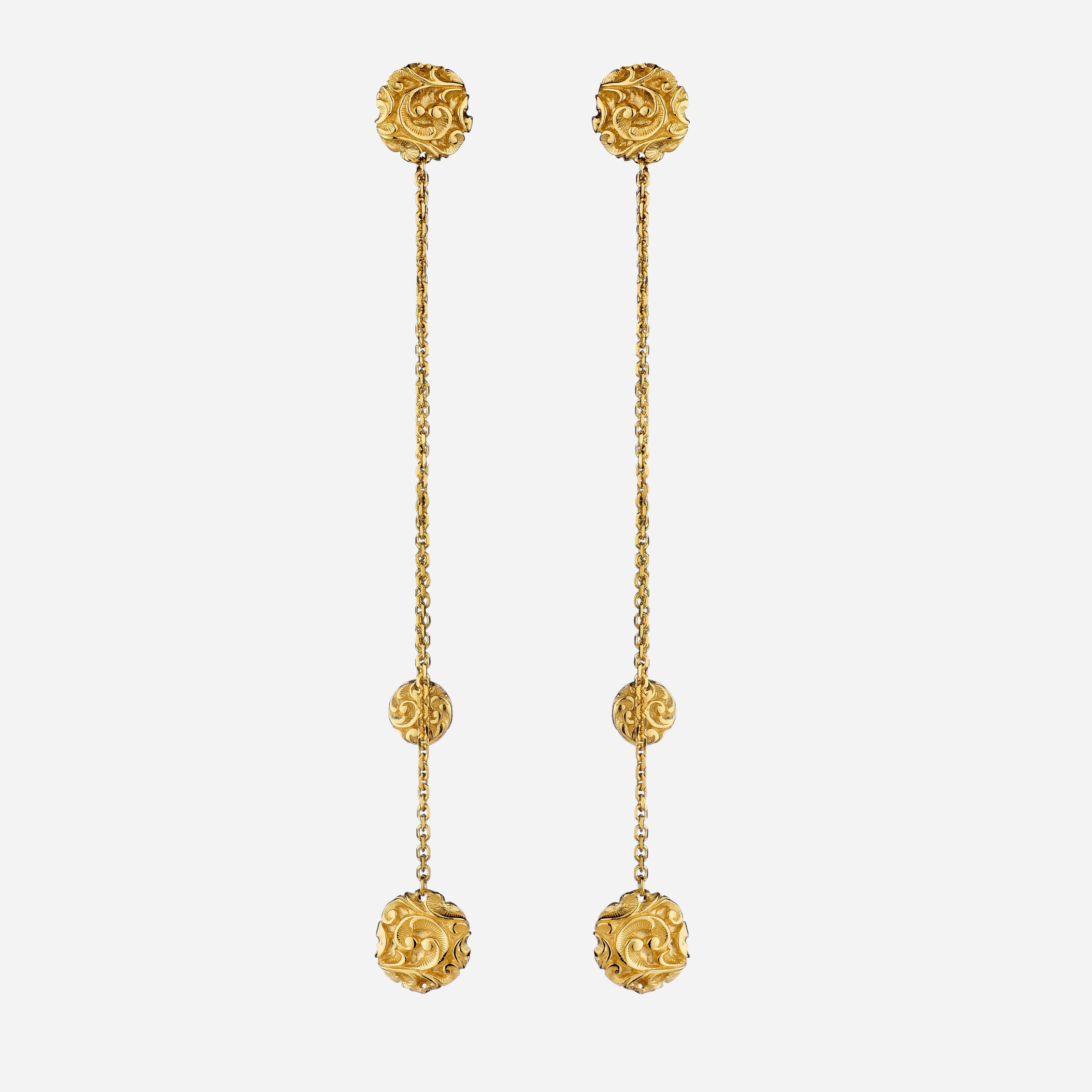 Carved gold earrings with hanging lentils